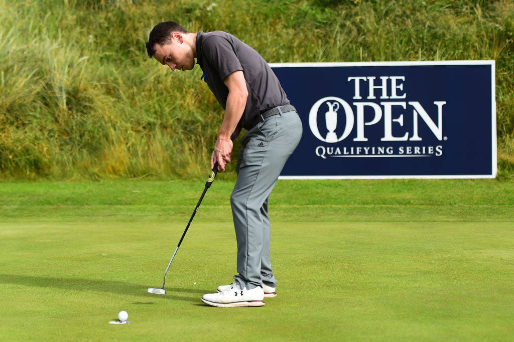 Chris Lewis holes a putt in Regional Qualifying